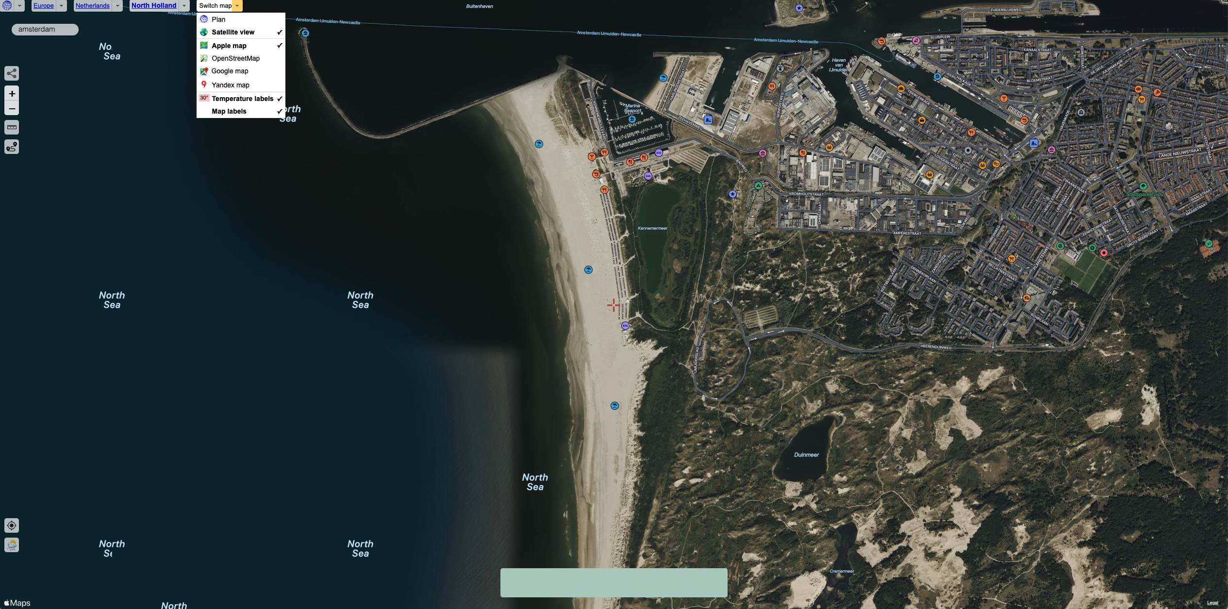 Screenshot of a search for Amsterdam using Apple Maps shows a satellite image of the land and sea.
